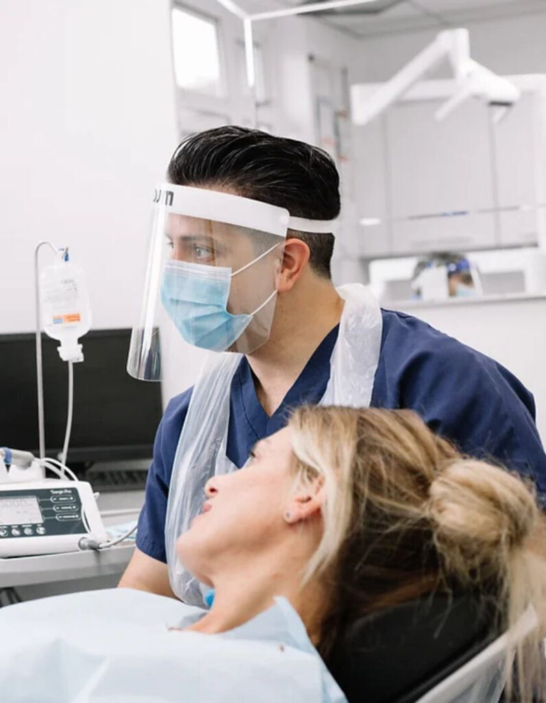Contact Dakatra - Patient in chair with Surgeon