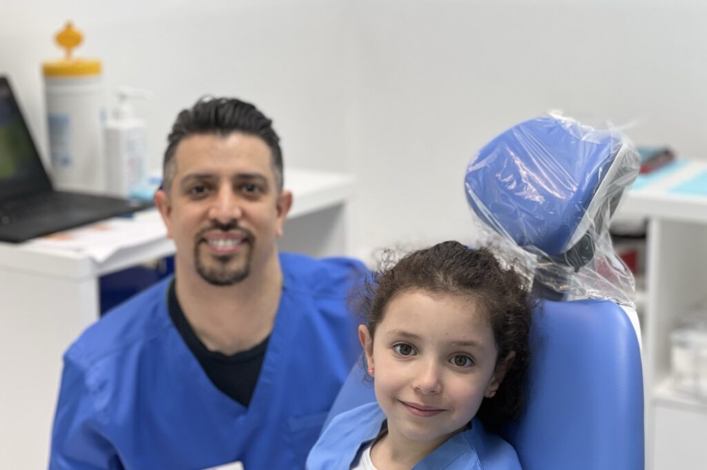 Dental surgeon with paediatric patient