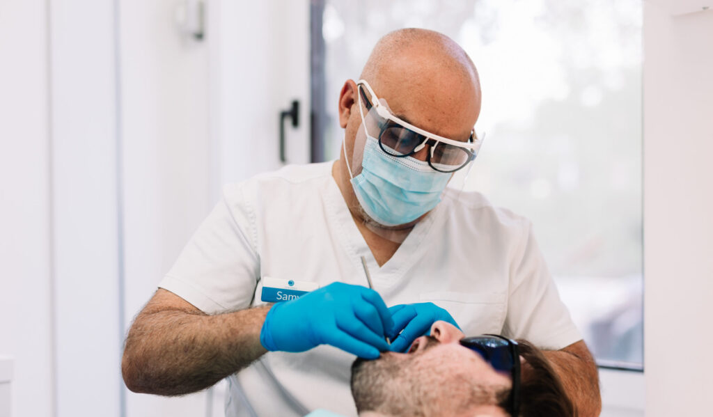 Surgeon with patient in the chair