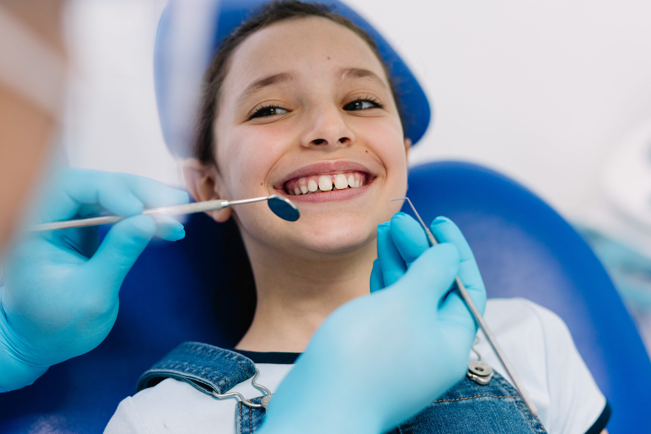 Young patient having a dental check-up with paediatric dentist.